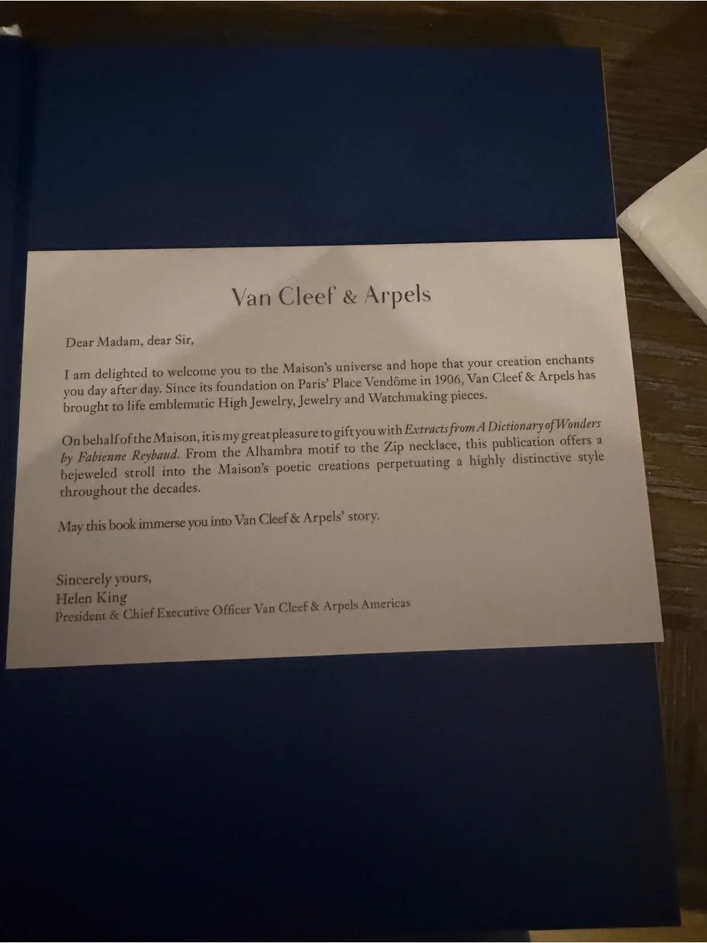 Van Cleef & Arpels White Book with Blue Title and Red Illustration